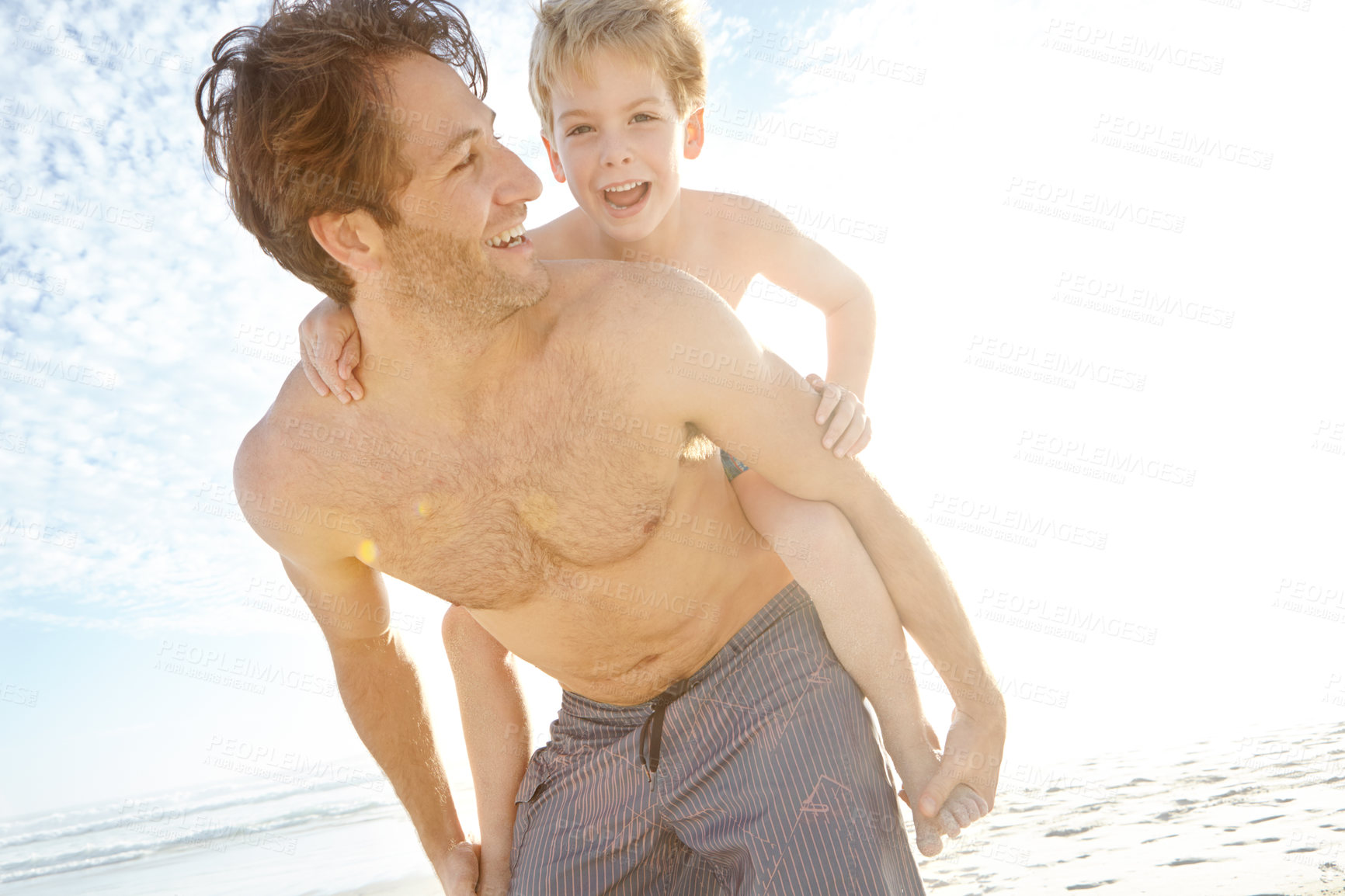 Buy stock photo Dad, boy and happy in beach with piggyback on holiday in summer, bonding and support in Miami. Parent, kid and smile or excited with fun at seaside on vacation, trip and travel for child development