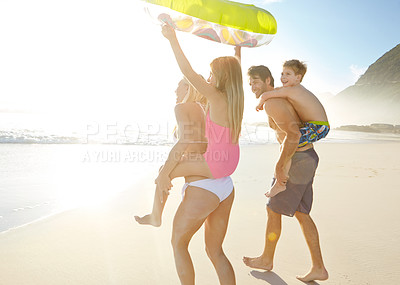 Buy stock photo Excited, family and children on back at beach together for bonding, relax and love for adventure in summer sunshine. Parents, kids and playful on vacation, care and support with ocean in Brazil