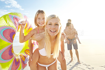 Buy stock photo Smile, woman and child on back at beach together for bonding, relax and love for adventure in summer sunshine. Portrait, family and playful race on ocean, trust and support for vacation in Australia