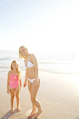 Buy stock photo Portrait, mother and happy kid at beach on holiday together for summer vacation, travel or mockup space. Smile, mom and girl child at ocean in swimsuit for adventure, care or family bonding by water