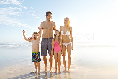 Buy stock photo Blue sky, smile and family with children at beach in swimsuit for holiday trip, summer vacation or weekend getaway. Fun, happy parents and young kids for travel, adventure or bonding together at sea