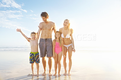 Buy stock photo Blue sky, family and happy children at beach in swimsuit for holiday trip, summer vacation or weekend getaway. Light, fun parents and young kids for travel, adventure or bonding together at sea