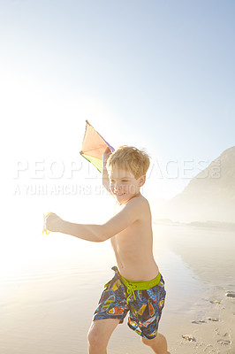 Buy stock photo Beach, boy and running with kite for playing, childhood development and growth with sports outdoor. Ocean, seaside and happy child on vacation, holiday and adventure in California with fun activity