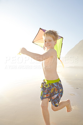 Buy stock photo Boy, running and kite on beach for fun, adventure and energy in sunshine or summer holiday. Excited child or happy kid with game for fantasy, imagination and wind with travel or vacation in nature 