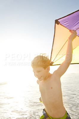 Buy stock photo Beach, child and running with kite for playing, childhood development and growth with sports outdoor. Ocean, seaside and happy boy on vacation, holiday and adventure in California with fun activity