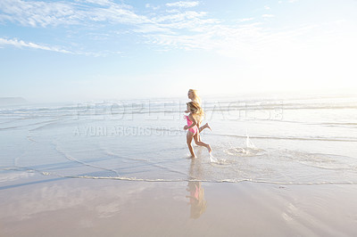 Buy stock photo Outdoor, mother and daughter in beach, running and excited for vacation, travel and trip to Cancun. Tropical, ocean or sea for woman and girl, fun and swimsuit for water, adventure and mom with child