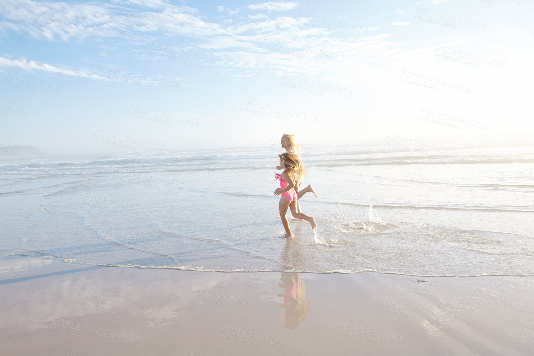 Buy stock photo Outdoor, mother and daughter in beach, running and excited for vacation, travel and trip to Cancun. Tropical, ocean or sea for woman and girl, fun and swimsuit for water, adventure and mom with child