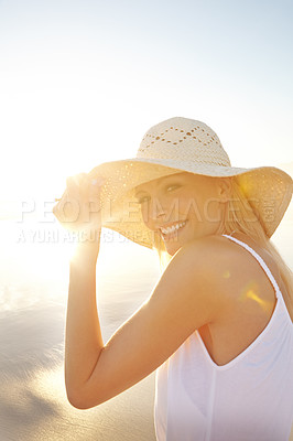 Buy stock photo Portrait, sunset and woman at sea with hat for summer sunshine, vacation travel and natural environment. Beach holiday, happy tourist girl and relax for peaceful walk and tropical adventure in Mexico