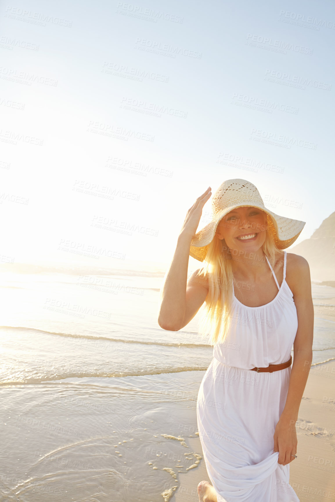 Buy stock photo Portrait, nature and woman walk on beach with hat for summer vacation, holiday trip or tropical getaway. Travel, outdoor and person with smile for happiness, weekend adventure or journey to Mexico