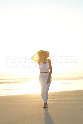 Buy stock photo Travel, portrait and woman walk on beach with hat for summer vacation, holiday trip or tropical getaway. Nature, sunset and female person for happiness, weekend adventure or outdoor journey in Bali