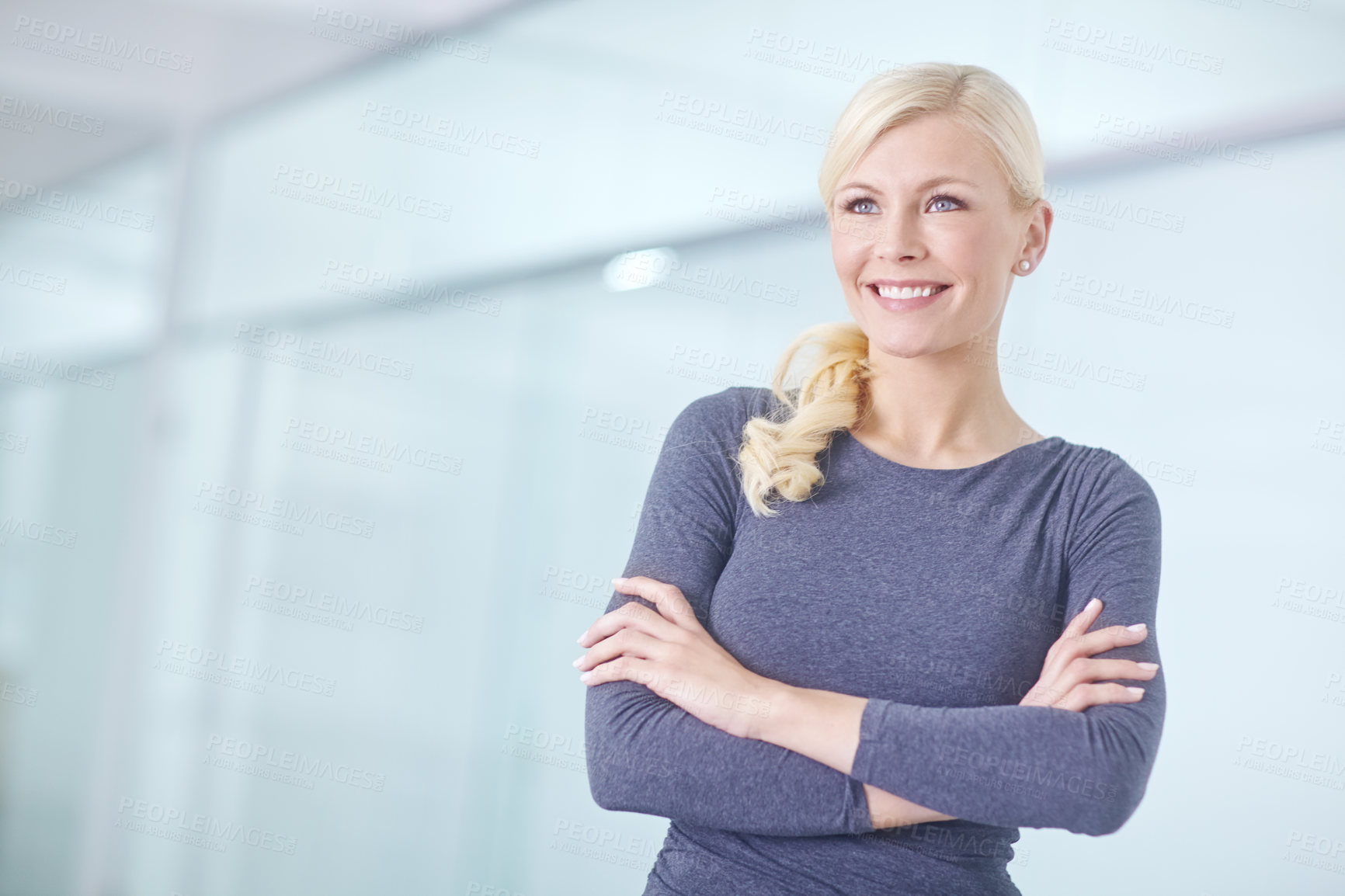 Buy stock photo Arms crossed, smile and thinking with business woman in hallway of office for start of career. Future, idea and vision with happy designer in creative workplace for professional administration