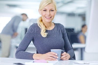 Buy stock photo Portrait of an attractive young woman drinking coffee while sitting at her desk in an office