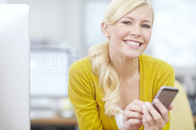 Buy stock photo Cropped shot of an attractive young businesswoman sending an sms