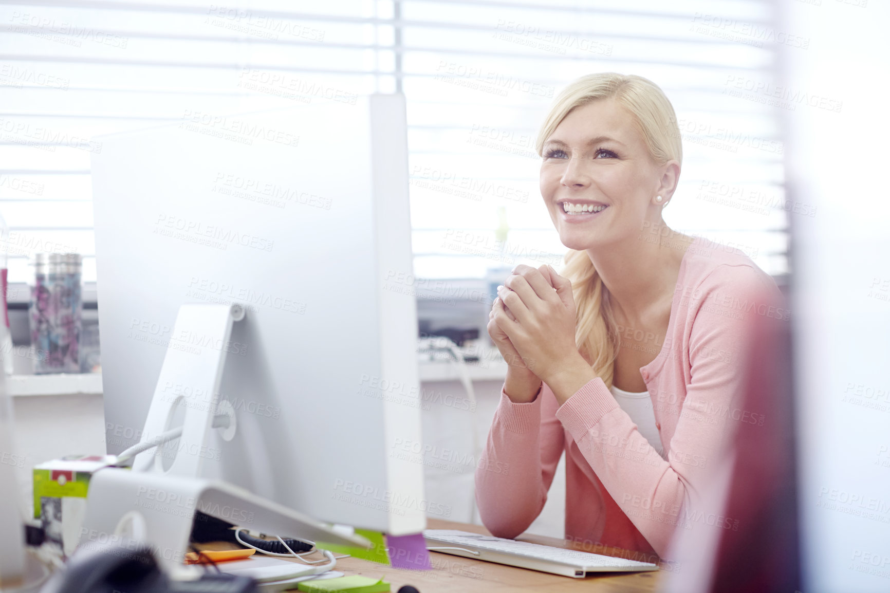 Buy stock photo Cropped shot of an attractive young businesswoman sitting at her desk during work