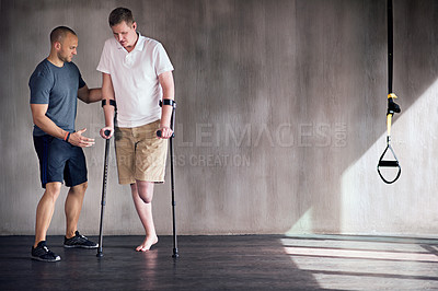 Buy stock photo Studio shot of a young amputee training in a gym