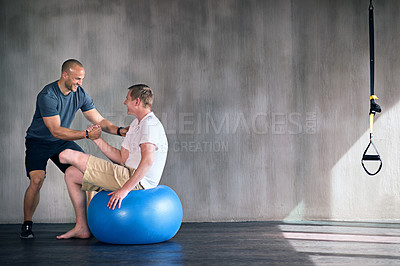 Buy stock photo Amputee, exercise ball and rehabilitation with physiotherapist at gym for training with motivation. Fitness, professional and patient with disability for wellbeing with workout, health and happy 