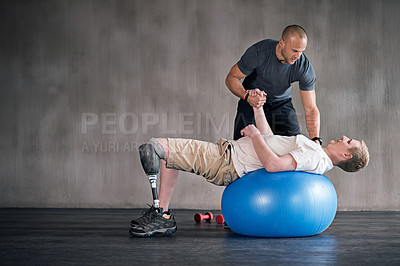 Buy stock photo Shot of a physiotherapist training with a patient