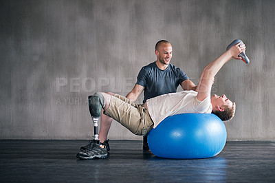 Buy stock photo Shot of a physiotherapist training with a patient