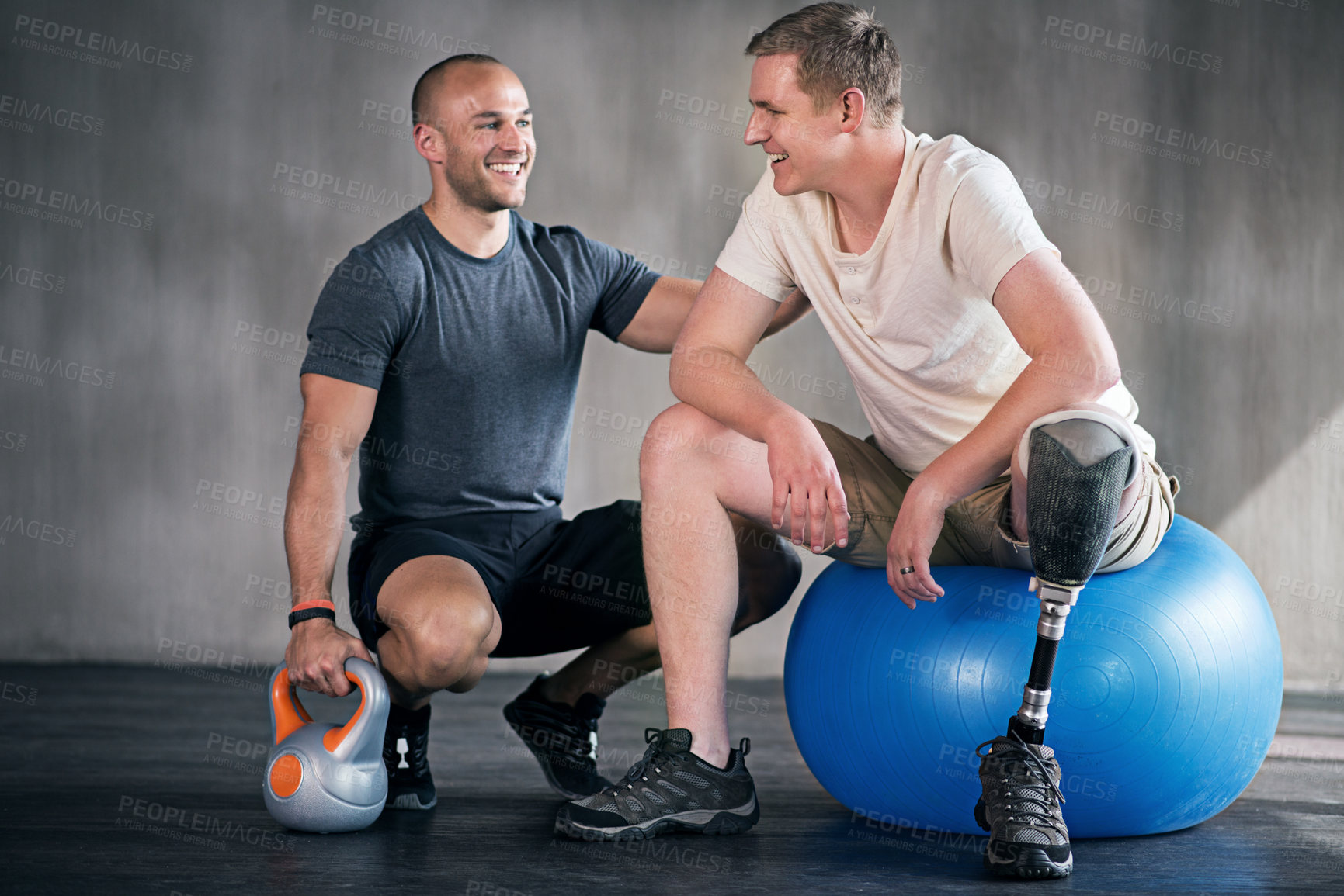 Buy stock photo Physiotherapy, kettlebell and man with disability for training, fitness and muscle strength with coach for support. Amputee, exercise ball and physiotherapist for physical rehabilitation with workout