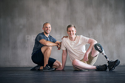 Buy stock photo Physiotherapist, person with a disability and prosthetic leg and smile in physiotherapy, studio and gym. Male people, trainer and amputee for wellness, fitness and exercise in sports center
 