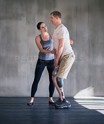 Buy stock photo Man, woman and physiotherapy for prosthetic, amputee and leg at rehabilitation, training and exercise. Physiotherapist, patient and fitness for workout, dumbbell and gym for man with a disability