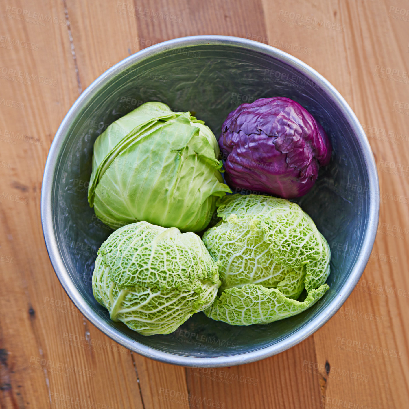 Buy stock photo Shot of a purple and green cabbage in a bowl