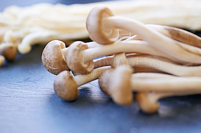 Buy stock photo Beech mushrooms, board and preparing in closeup with fibre for protein in healthy diet with vegetables for cooking. Vitamin b, nutrition and vegetable with groceries, eating and organic for health