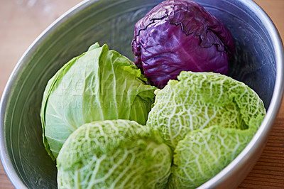 Buy stock photo Green, red and cabbages in food for salad, nutrition and cooking in kitchen for vegetarian. Fresh, vegetables and organic in bowl for vegan, meal and prep in healthy diet for wellness on tabletop. 
