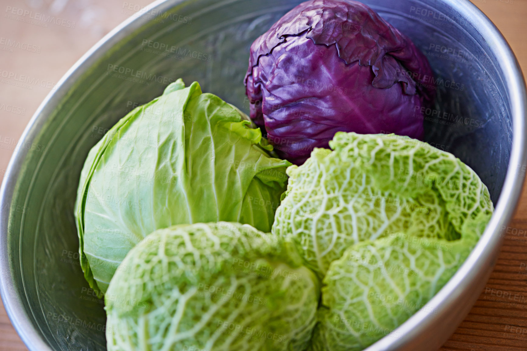 Buy stock photo Green, red and cabbages in food for salad, nutrition and cooking in kitchen for vegetarian. Fresh, vegetables and organic in bowl for vegan, meal and prep in healthy diet for wellness on tabletop. 
