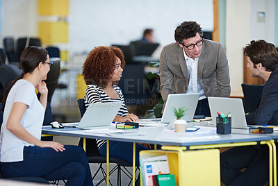 Buy stock photo Collaboration, business and conversation in office for brainstorming new company, workshop and internship. Men, women and teamwork at desk with laptop for web design, planning and startup project