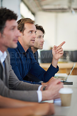 Buy stock photo Cropped shot of business people around a table