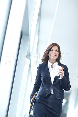 Buy stock photo Coffee, walking and businesswoman in office with confidence, smile or report at legal consultancy. Drinking tea beverage, happy advisor or proud lawyer with files, folder and documents in law firm