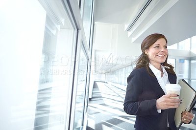 Buy stock photo Walking, coffee or businesswoman in office with smile, beverage or folder at legal consultancy. Drinking tea, happy or confident lawyer with files, documents or paperwork by window in law firm lobby