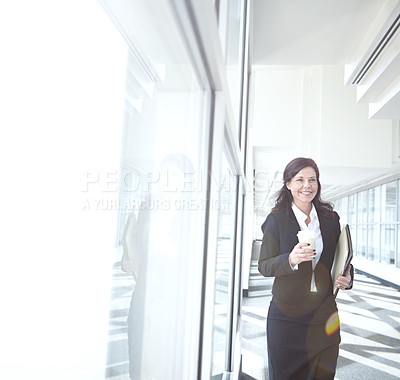 Buy stock photo Walking, coffee or businesswoman in office with folder, beverage or report at legal consultancy. Drinking tea, happy or confident lawyer with files, documents or paperwork by window in law firm lobby