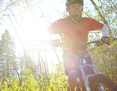 Buy stock photo Man, fitness and training with bicycle in forest as exercise or workout for health, wellbeing and wellness. Lens flare, male person and cyclists in woods for hobby, sport activity and competition