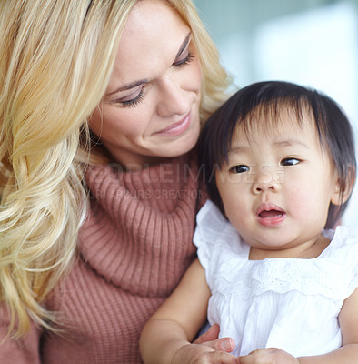 Buy stock photo Love, mom and foster baby in home for care, support and family bonding together. Mother, kid and cute adopted child with parent for connection, diversity and interracial relationship with toddler