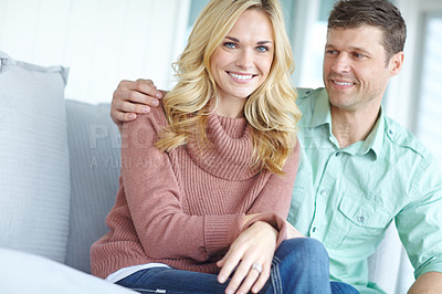 Buy stock photo Portrait, love and happy couple in home for care, relax and bonding together in living room. Face, man and smile of woman on sofa with partner for support, connection or healthy relationship in house