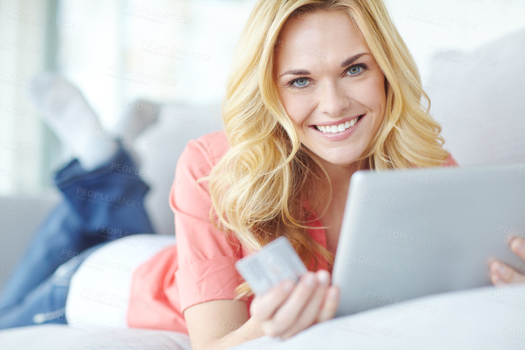 Buy stock photo Portrait of a beautiful young woman using her digital tablet and credit card to shop online