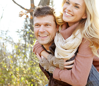 Buy stock photo Couple, relax and piggyback with smile in forest for outdoor break, anniversary and love in morning. Woman, man and happy with affection in nature for tourism, adventure and weekend in New Zealand