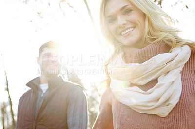 Buy stock photo Portrait, couple and walking in nature for support and adventure or love in woods or forest. Man, woman and smile or together for outdoor date, sunshine and trees in morning for anniversary and care