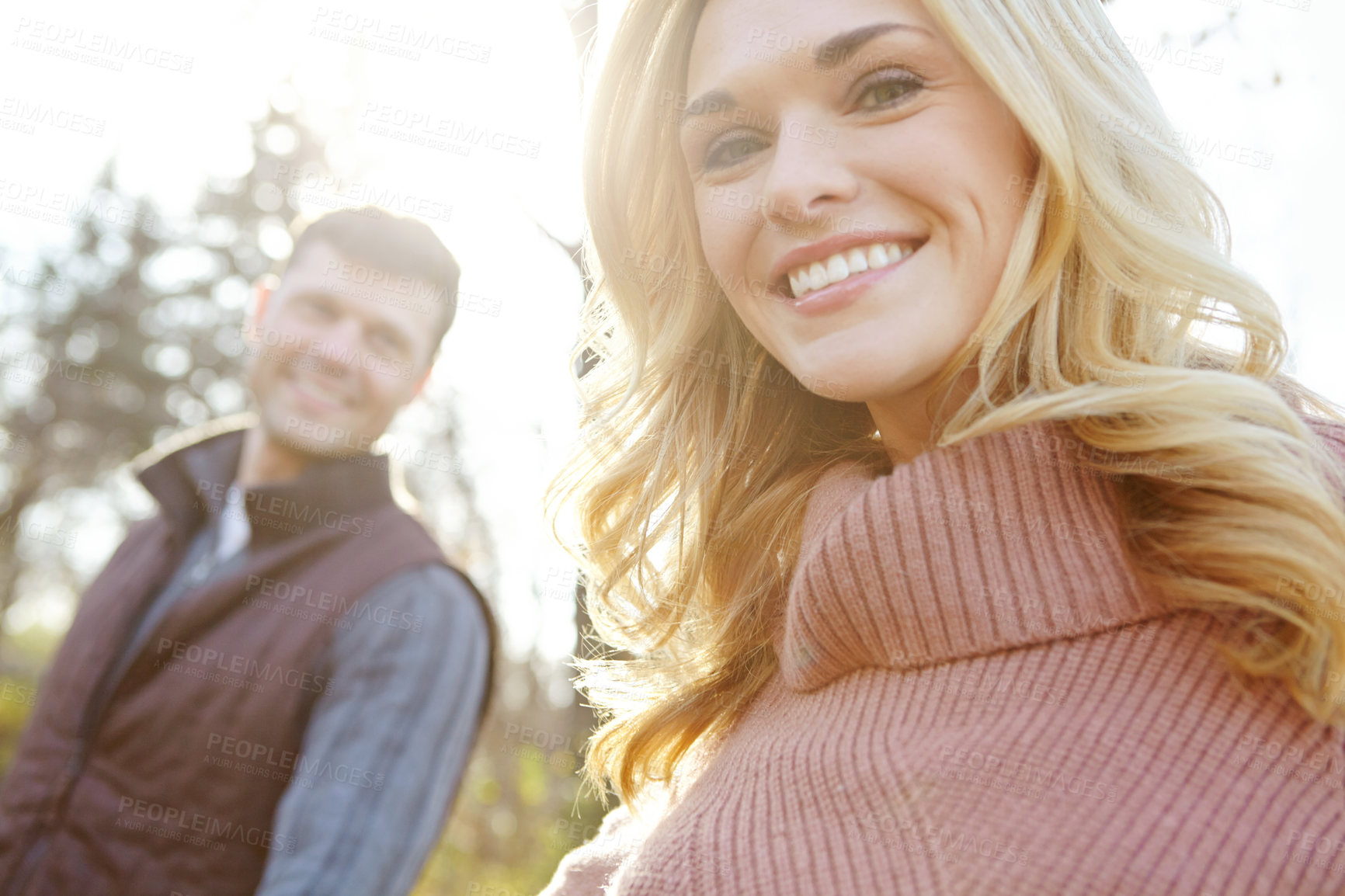 Buy stock photo Nature, couple and portrait of happy woman in forest for adventure or love in woods or park. Man, smile and together for outdoor date, support and trees in morning for anniversary, romance and travel