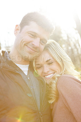 Buy stock photo Love, couple and happy in nature for hug, support and adventure in woods or forest. Man, woman and smile or together for outdoor date, travel and embrace in morning for anniversary, care and wellness