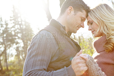 Buy stock photo Man, woman and holding hands in forest for support and adventure or love in woods or nature. Couple, smile and together for outdoor date, sunshine and trees in morning for engagement in countryside