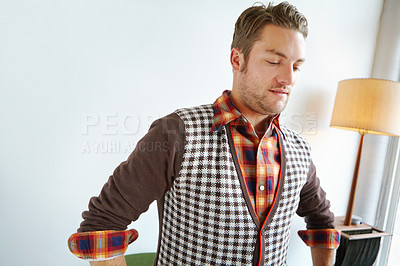 Buy stock photo A handsome young man in a trendy outfit standing in a home interior