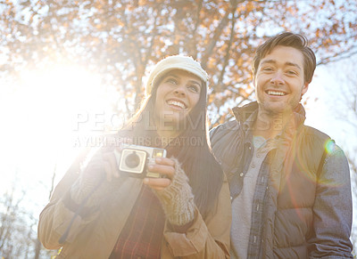 Buy stock photo Happy, couple and camera for photography outdoor with adventure travel, explore nature and sightseeing memory. Smile, woman and man with vintage tech of bonding, picture together or location scenery 