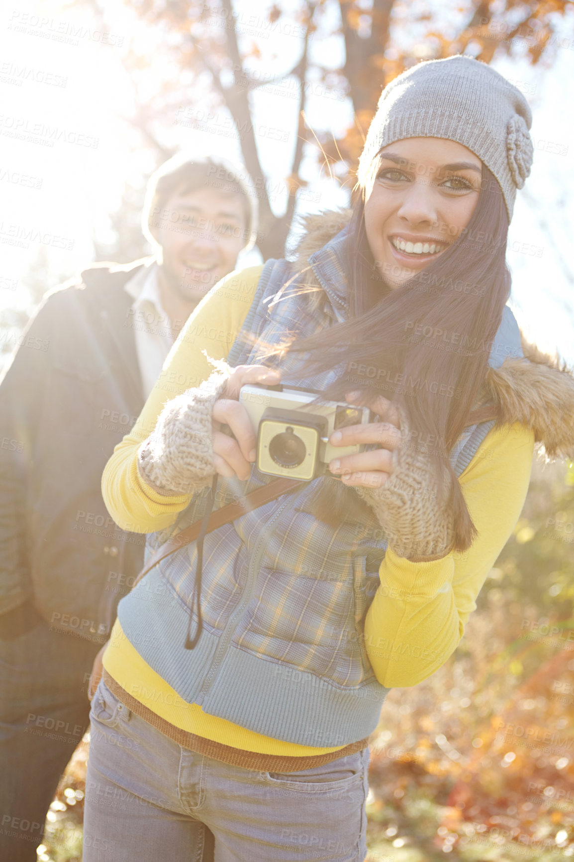 Buy stock photo Couple, camera and happy for photography outdoor with adventure travel, explore nature and sightseeing memory. Smile, woman and man with vintage tech of bonding, picture together or location scenery 