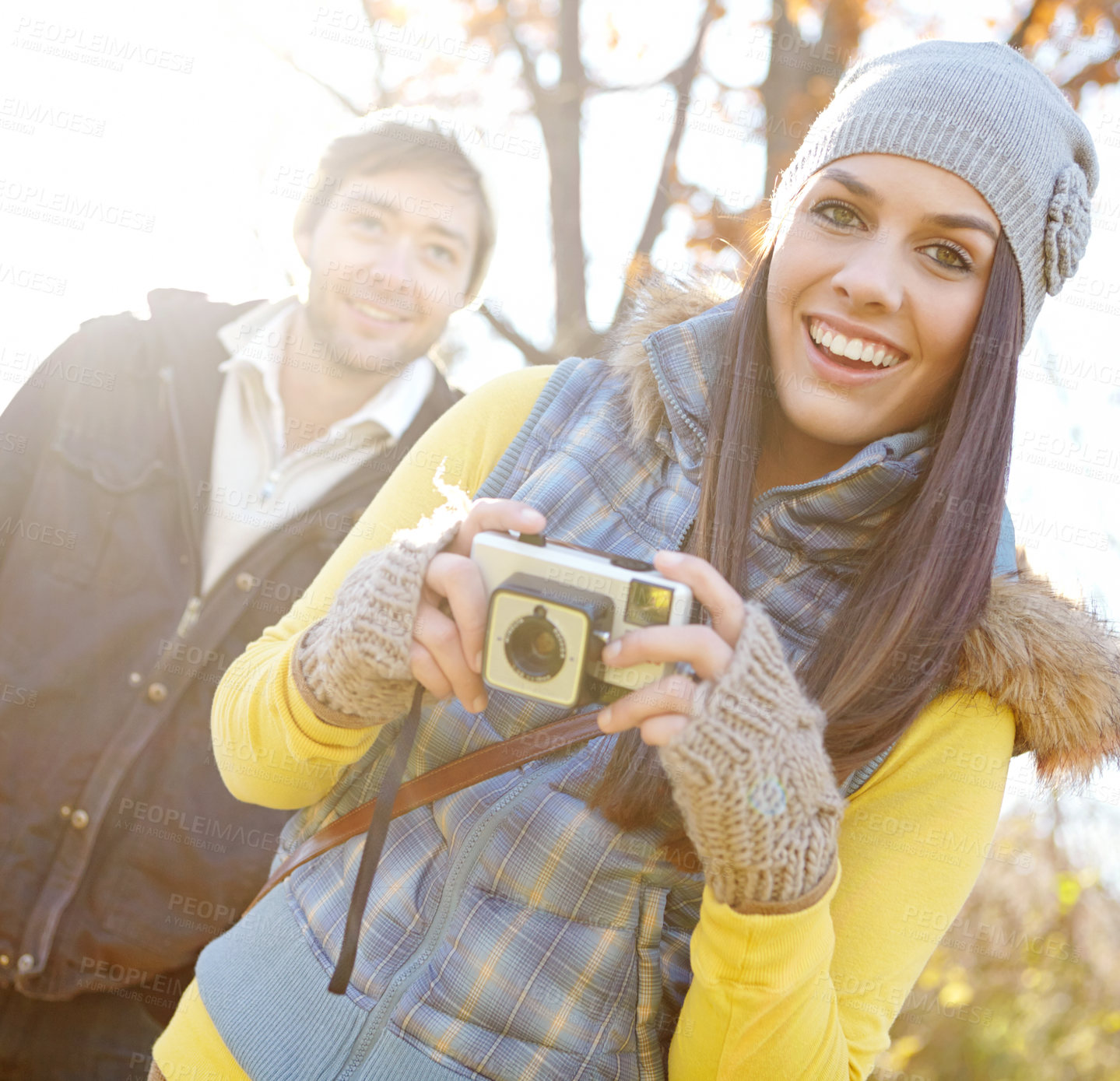 Buy stock photo Couple, smile and camera for photography outdoor with adventure travel, explore nature and sightseeing memory. Happy, woman and man with vintage tech of bonding, picture together or location scenery 