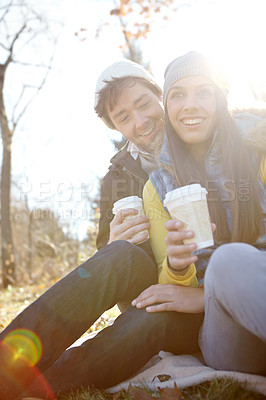 Buy stock photo People, couple and smile in forest with coffee cup as nature lovers and bonding in Germany. Relationship, love and happy in park or woods on winter holiday, sightseeing and adventure for break