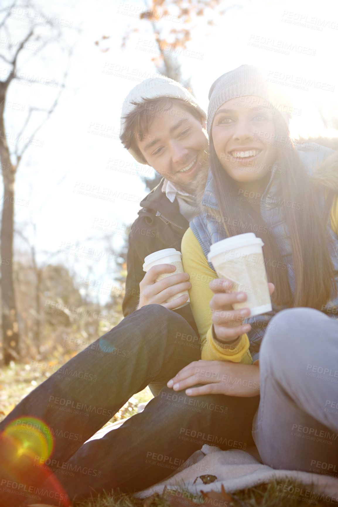 Buy stock photo People, couple and smile in forest with coffee cup as nature lovers and bonding in Germany. Relationship, love and happy in park or woods on winter holiday, sightseeing and adventure for break