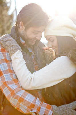 Buy stock photo Happy couple, winter and affection for love in forest with care, warm clothes and outdoor date. Smile, man and woman with romance in nature with bonding together, loyalty and fashion for cold climate